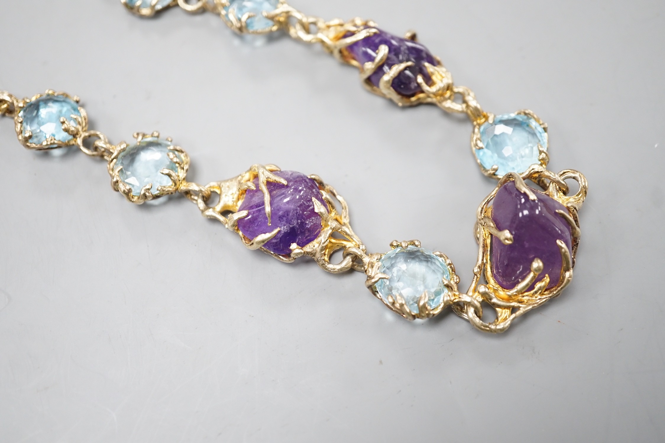 A gilt 925 amethyst pebble and gem set necklace, 42cm.